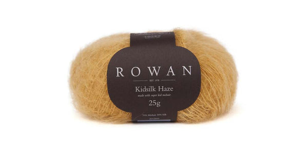 Soft orange Rowan Kidsilk Haze yarn ball, lightweight and delicate for knitting or crochet projects.