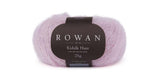 Soft Rowan Kidsilk Haze yarn in a vibrant lilac color, showcasing delicate, lightweight fibers ideal for knitting and crochet projects.