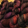Close-up of Zen Yarn Garden Serenity 20 fingering weight yarn in vibrant Vixen color, showcasing soft texture and fine fibers.