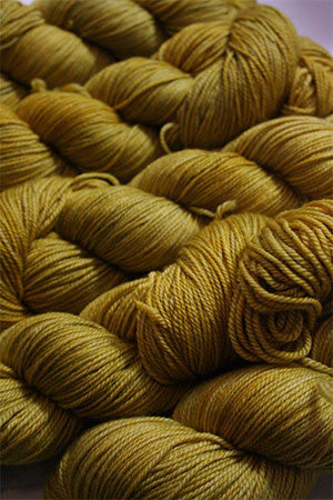 Fingering weight yarn from Zen Yarn Garden's Serenity 20 collection in soft blue and beige tones, displayed in a close-up shot.