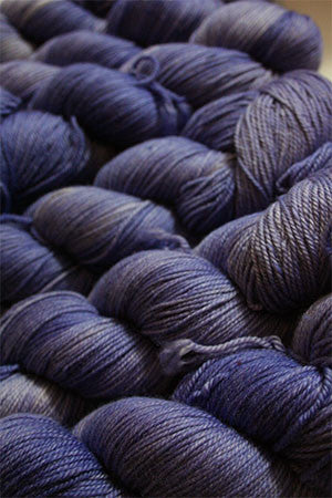 Fingering weight yarn by Zen Yarn Garden in a soft periwinkle color, showcasing the Serenity 20 collection.
