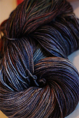 Close-up of Zen Yarn Garden Serenity 20 fingering weight yarn in soft, variegated shades with a smooth, silky texture.