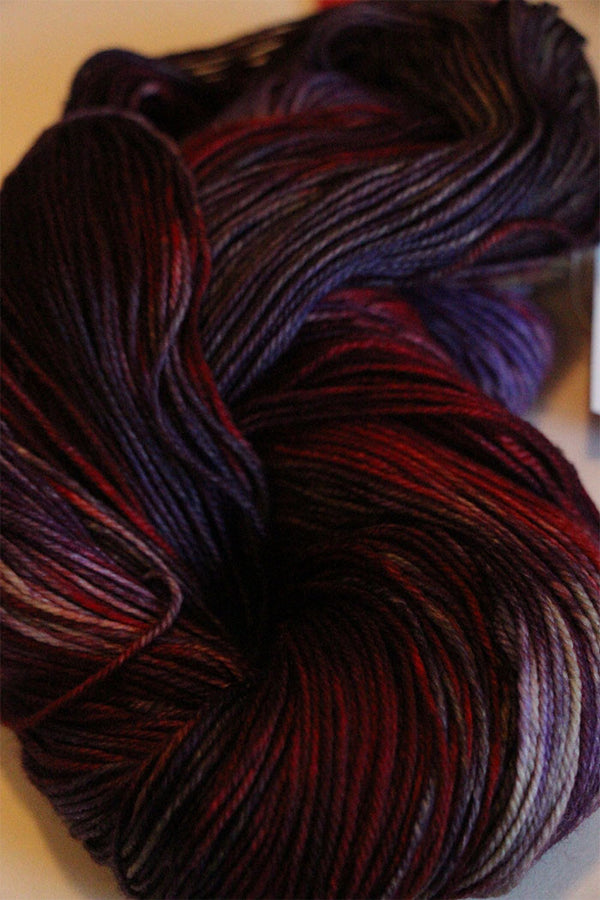 Fingering weight yarn in soft pastel shades from Zen Yarn Garden's Serenity 20 collection, showcasing vibrant, hand-dyed fibers.
