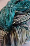 Close-up of Zen Yarn Garden Serenity 20 fingering weight yarn in deep jet black with subtle sheen and fine texture.
