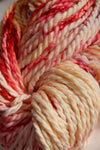 Close-up of Zen Yarn Garden Serenity 20 fingering weight yarn in vibrant, multicolored skein with soft, smooth fiber texture.