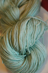 Fingering weight yarn by Zen Yarn Garden in vibrant African jade color, showcasing soft, high-quality Zen Yarn Garden Serenity 20.