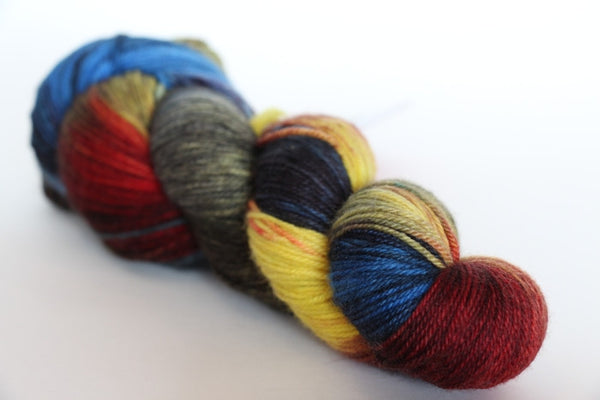 Fingering weight yarn from Zen Yarn Garden's Serenity 20 collection, showing soft, multicolored skein with vibrant hues.