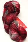 Fingering weight Serenity 20 yarn by Zen Yarn Garden, showing soft, colorful skein with intricate texture.