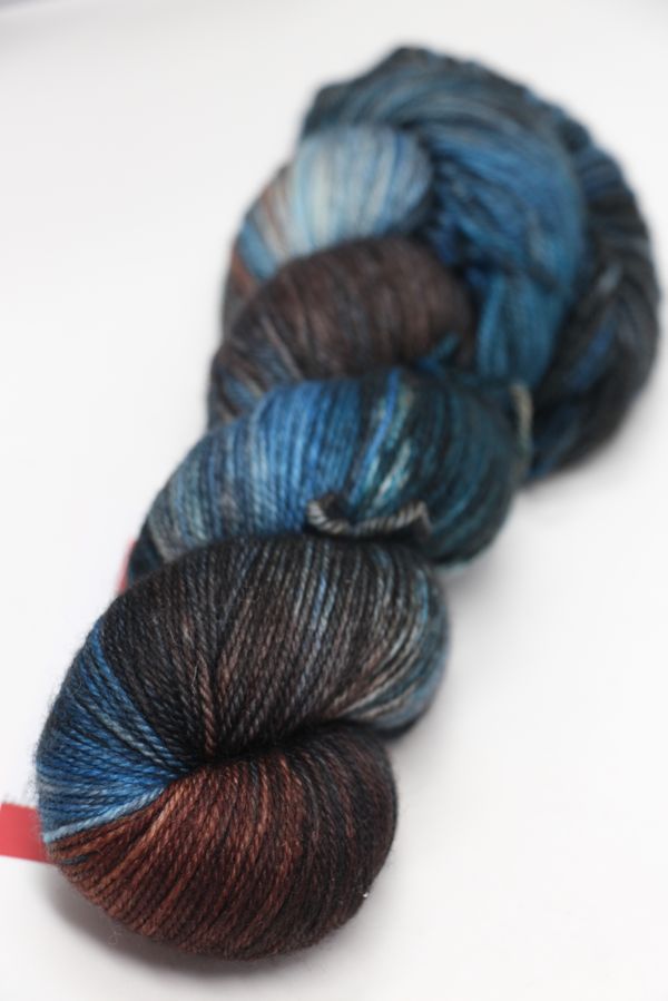 Fingering weight yarn from Zen Yarn Garden's Serenity 20 collection in a soft, variegated colorway with subtle shades.