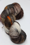 Fingering weight yarn in Clay Sand color from Zen Yarn Garden's Serenity 20 collection, showcasing soft, variegated yarn fibers.