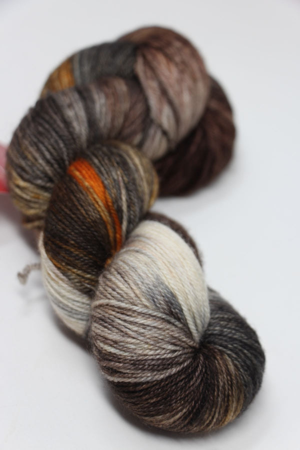 Fingering weight yarn in Clay Sand color from Zen Yarn Garden's Serenity 20 collection, showcasing soft, variegated yarn fibers.