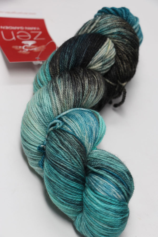 Fingering weight yarn Zen Yarn Garden Serenity 20 in jetsetter colorway, soft fiber with rich, variegated purple and gray tones.