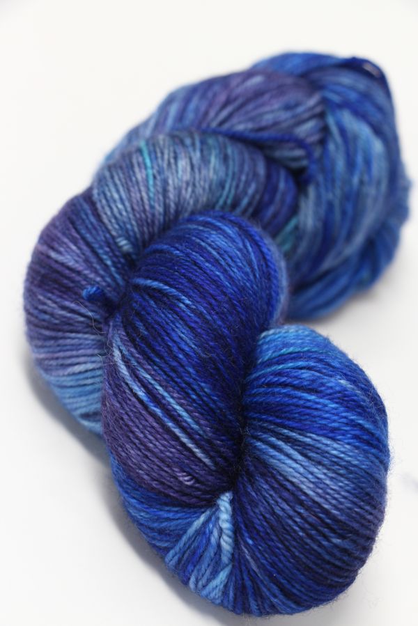 Blue and violet fingering weight yarn from Zen Yarn Garden's Serenity 20 collection, showcasing vibrant, soft fiber texture.