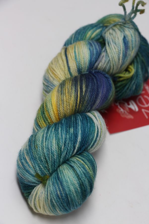 Fingering weight yarn by Zen Yarn Garden, Serenity 20 in New Apple color, showcasing soft, vibrant fiber for knitting or crochet projects
