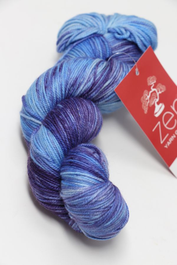 Fingering weight yarn from Zen Yarn Garden's Serenity 20 collection in a vibrant blur pie colorway with soft, smooth fibers.