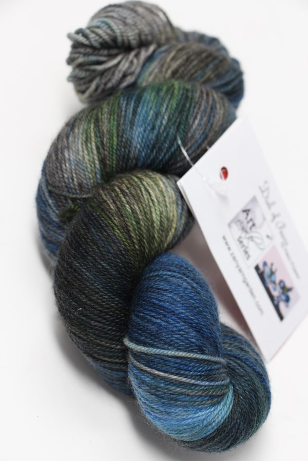 Fingering weight yarn Zen Yarn Garden Serenity 20 in a dish of pears colorway, showcasing soft, vibrant fiber strands.
