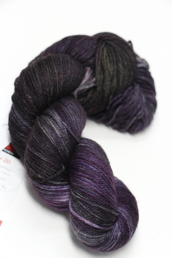 Fingering weight yarn from Zen Yarn Garden's Serenity 20 collection in rich wine cork color, showcasing soft, high-quality fibers.