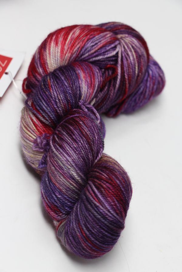 Fingering weight yarn Zen Yarn Garden Serenity 20 in Fairyland colorway, showcasing soft, colorful skein with vibrant hues.