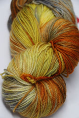 Fingering weight yarn Zen Yarn Garden Serenity 20 in Koi colorway, soft and vibrant, with subtle color variations for knitting or crochet projects.