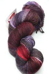 Fingering weight yarn by Zen Yarn Garden in Velvet Cake colorway, showcasing soft, vibrant pink tones and smooth fiber texture.
