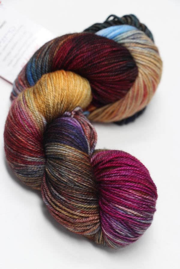 Fingering weight yarn from Zen Yarn Garden's Serenity 20 collection, showcasing soft, multicolored skein with subtle tonal variations.