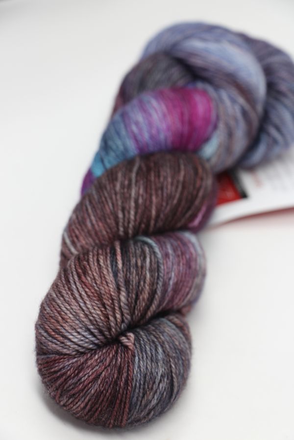 Fingering weight yarn from Zen Yarn Garden's Serenity 20 collection in hypnotic, vibrant colors, displayed in a close-up image.