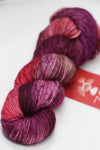 Fingering weight yarn from Zen Yarn Garden's Serenity 20 collection in soft, variegated shades, displayed in a close-up shot.
