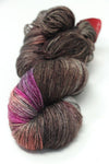 Fingering weight yarn from Zen Yarn Garden's Serenity 20 collection in marooned color, showcasing soft, smooth fiber texture.