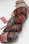 Fingering weight yarn from Zen Yarn Garden's Serenity 20 collection in vibrant cayenne pepper color.