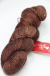 Fingering weight yarn from Zen Yarn Garden's Serenity 20 collection in chestnut color, soft and finely spun for knitting or crochet.