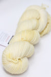 Fingering weight yarn from Zen Yarn Garden's Serenity 20 collection in French Vanilla color, showcasing soft, smooth fiber texture.