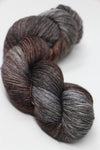 Fingering weight yarn from Zen Yarn Garden's Serenity 20 collection in a rich wrought iron color, showcased in a close-up shot.